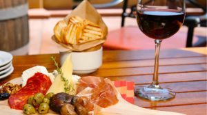 369582_2050jav01_world_-alfresco-tasting-room-charcuterie-and-cheese-board-with-wine_16-9